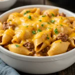 Crockpot Cheesy Ranch Beef Pasta Shells in rustic white bowl