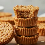 No bake peanut butter oat cups stacked on rustic board