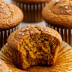 Baked Spiced Pumpkin Muffins with tall domes and moist crumb