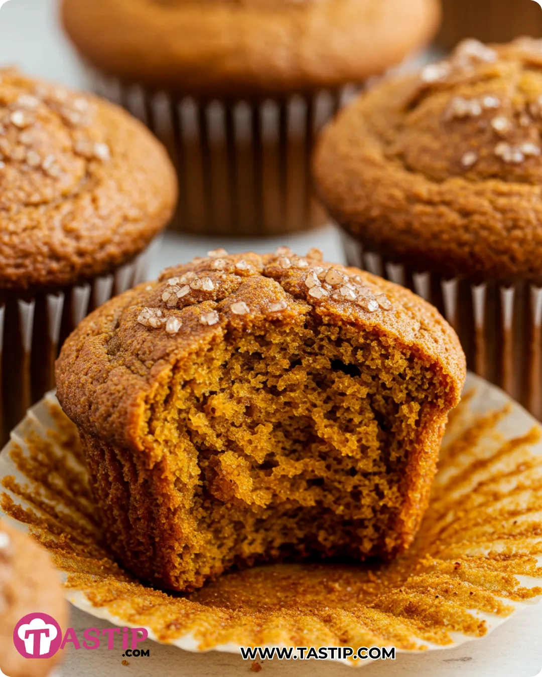 Baked Spiced Pumpkin Muffins with tall domes and moist crumb
