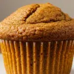 Greek Yogurt Pumpkin Muffins stacked with domed tops