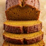 Homemade Pumpkin Bread sliced loaf with crackly cinnamon top